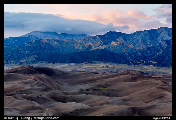 Dunes and mountains with fall colors at dusk. Great Sand Dunes National Park and Preserve (color)
