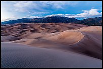 Dunes and Sangre de Cristo mountains at dusk. Great Sand Dunes National Park, Colorado, USA. (color)