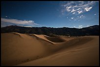 Dunes and mountains at night. Great Sand Dunes National Park, Colorado, USA. (color)