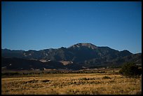 Dunefield and Mount Herard at night. Great Sand Dunes National Park and Preserve, Colorado, USA.