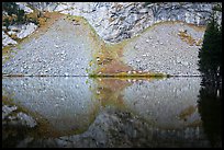 Rock talus reflected in Lower Sand Creek Lake. Great Sand Dunes National Park and Preserve ( color)