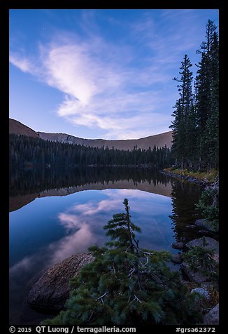 Clouds and Lower Sand Creek Lake at dusk. Great Sand Dunes National Park and Preserve, Colorado, USA.