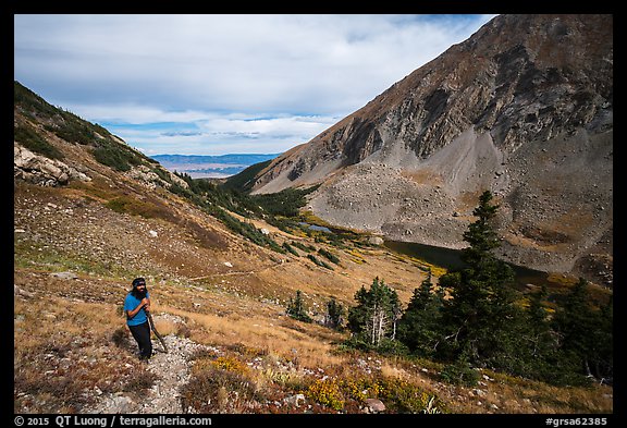 Hiker above Medano Lakes. Great Sand Dunes National Park and Preserve, Colorado, USA.