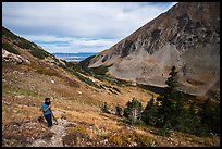 Hiker above Medano Lakes. Great Sand Dunes National Park and Preserve, Colorado, USA.