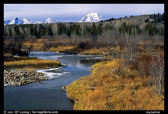 Stream, with Mt Moran emerging from ridige, late fall. Grand Teton National Park, Wyoming, USA.