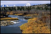 Stream, with Mt Moran emerging from ridige, late fall. Grand Teton National Park, Wyoming, USA.