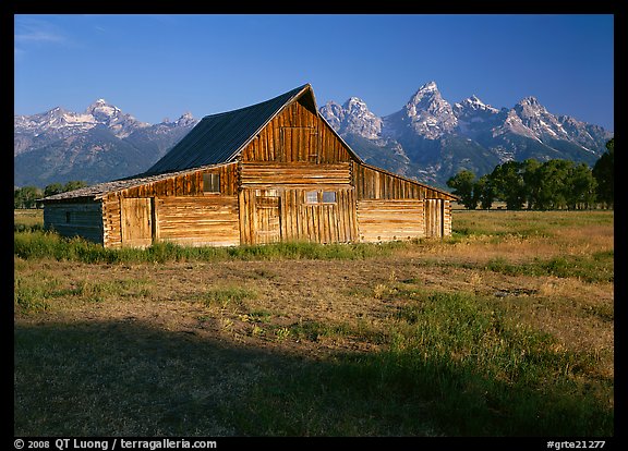 Historic Barn and Teton range, morning. Grand Teton National Park, Wyoming, USA.