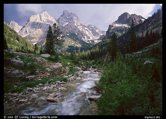 Valley, Cascade creek and Teton range with storm light. Grand Teton National Park, Wyoming, USA.