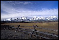 Fence, meadow, and Teton Range. Grand Teton National Park, Wyoming, USA.