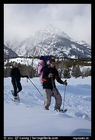 Couple snowshowing with baby. Grand Teton National Park (color)