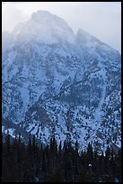 Towering mountain in winter. Grand Teton National Park, Wyoming, USA.