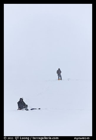 Ice fishermen on Frozen Jackson Lake. Grand Teton National Park, Wyoming, USA.