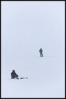 Ice fishermen on Frozen Jackson Lake. Grand Teton National Park, Wyoming, USA.