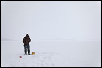 Ice fishing on Jackson Lake. Grand Teton National Park, Wyoming, USA.