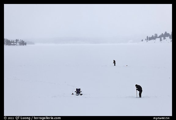 Jackson Lake in winter with ice fishermen. Grand Teton National Park, Wyoming, USA.