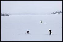 Jackson Lake in winter with ice fishermen. Grand Teton National Park, Wyoming, USA.