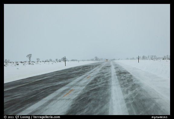 Road with snowdrift in winter. Grand Teton National Park, Wyoming, USA.
