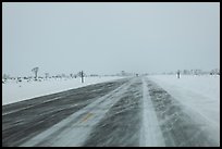 Road with snowdrift in winter. Grand Teton National Park, Wyoming, USA.