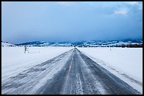 Road in winter at dusk, Gross Ventre valley. Grand Teton National Park, Wyoming, USA. (color)