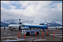 Regional jet and fuel truck, Jackson Hole Airport. Grand Teton National Park, Wyoming, USA. (color)