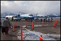 Passengers walking towards plane on Jackson Hole Airport. Grand Teton National Park, Wyoming, USA.