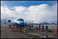 Passengers boarding aircraft, Jackson Hole Airport, winter. Grand Teton National Park, Wyoming, USA. (color)