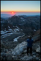 Mountaineer photographs sunset from Lower Saddle. Grand Teton National Park ( color)