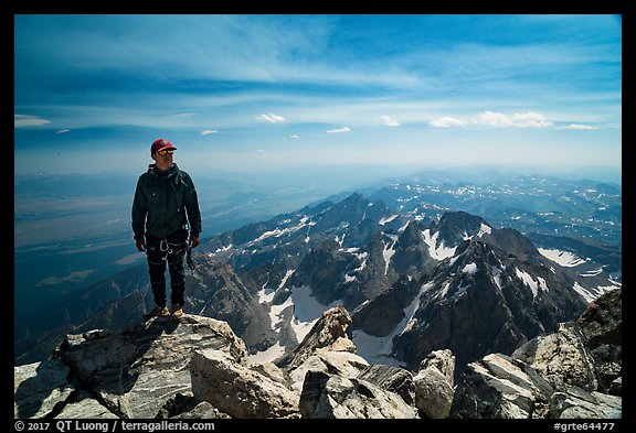 Climber standing on summit of Grand Teton. Grand Teton National Park (color)
