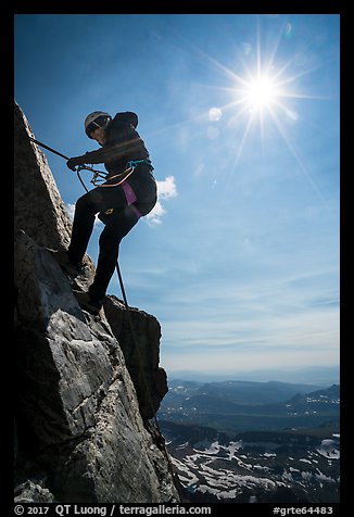 Woman climber rappelling on Grand Teton. Grand Teton National Park (color)