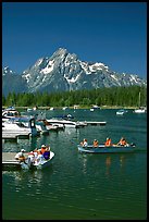 Boaters at Colter Bay marina with Mt Moran in the background, morning. Grand Teton National Park, Wyoming, USA.