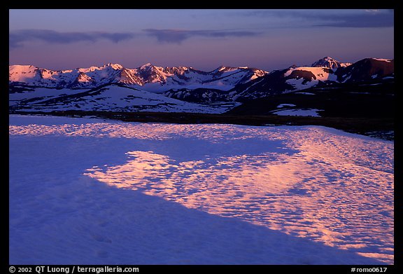 Neve near Rock Cut and Never Summer range in early summer at sunset. Rocky Mountain National Park, Colorado, USA.