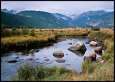 Creek, boulders, and meadow surrounded by mountains, autumn. Rocky Mountain National Park, Colorado, USA. (color)