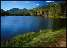 Sprague Lake, and forested peaks, morning. Rocky Mountain National Park, Colorado, USA.