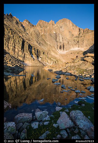 Longs Peak Diamond rises above Longs Peak at sunrise. Rocky Mountain National Park, Colorado, USA.