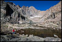 Park visitor Looking, Chasm Lake. Rocky Mountain National Park, Colorado, USA.