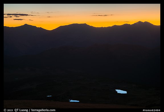 Alpine lakes reflecting the sky below mountain ridges at sunset. Rocky Mountain National Park, Colorado, USA.