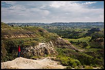 Park visitor looking, North Dakota Badlands Overlook. Theodore Roosevelt National Park, North Dakota, USA.