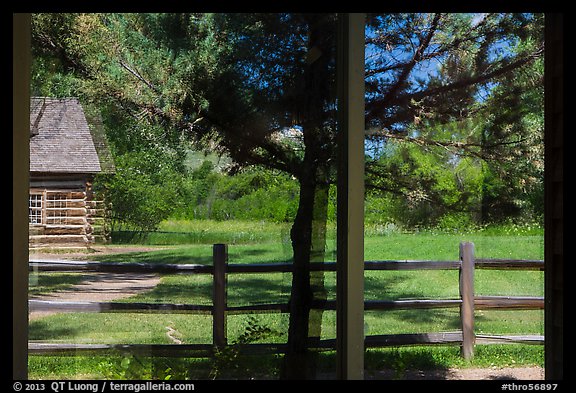 Maltese Cross cabin, Medora Visitor Center window reflexion. Theodore Roosevelt National Park, North Dakota, USA.