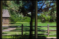 Maltese Cross cabin, Medora Visitor Center window reflexion. Theodore Roosevelt National Park, North Dakota, USA. (color)