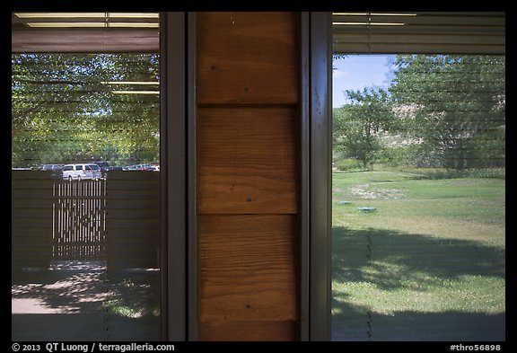 Meadow and parking lot, Medora Visitor Center window reflexion. Theodore Roosevelt National Park (color)