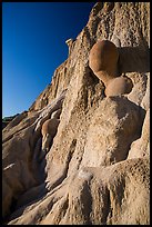 Cannonball concretions on cliff. Theodore Roosevelt National Park, North Dakota, USA. (color)
