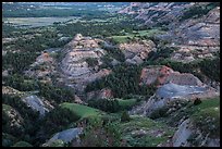 Badlands in summer at dusk. Theodore Roosevelt National Park, North Dakota, USA. (color)