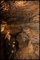 Ranger lights up boxwork in the Elks Room. Wind Cave National Park ( color)