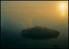 Fishing cone, fog, and  sun rising. Yellowstone National Park ( color)