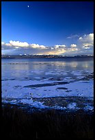 Yellowstone Lake with frozen shores, sunset. Yellowstone National Park, Wyoming, USA.