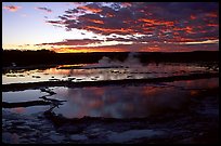 Great Fountain geyser and colorful clouds at sunset. Yellowstone National Park, Wyoming, USA. (color)
