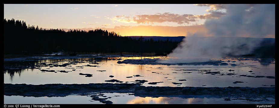 Steam rising in geyser pool at sunset. Yellowstone National Park (color)
