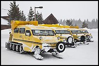 Snow coaches parked at Flagg Ranch. Yellowstone National Park, Wyoming, USA. (color)