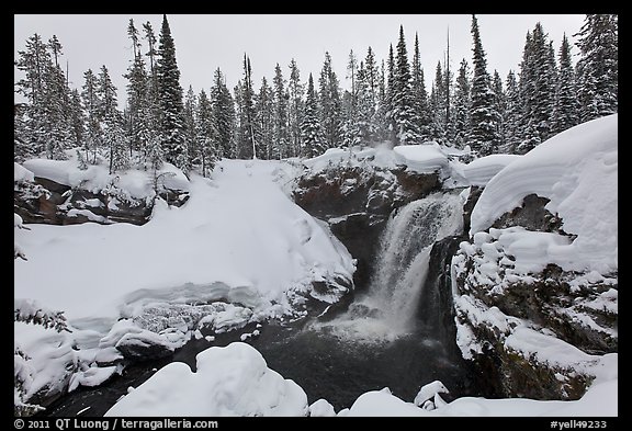 Snowy landscape with waterfall. Yellowstone National Park, Wyoming, USA.