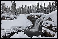 Snowy landscape with waterfall. Yellowstone National Park, Wyoming, USA.